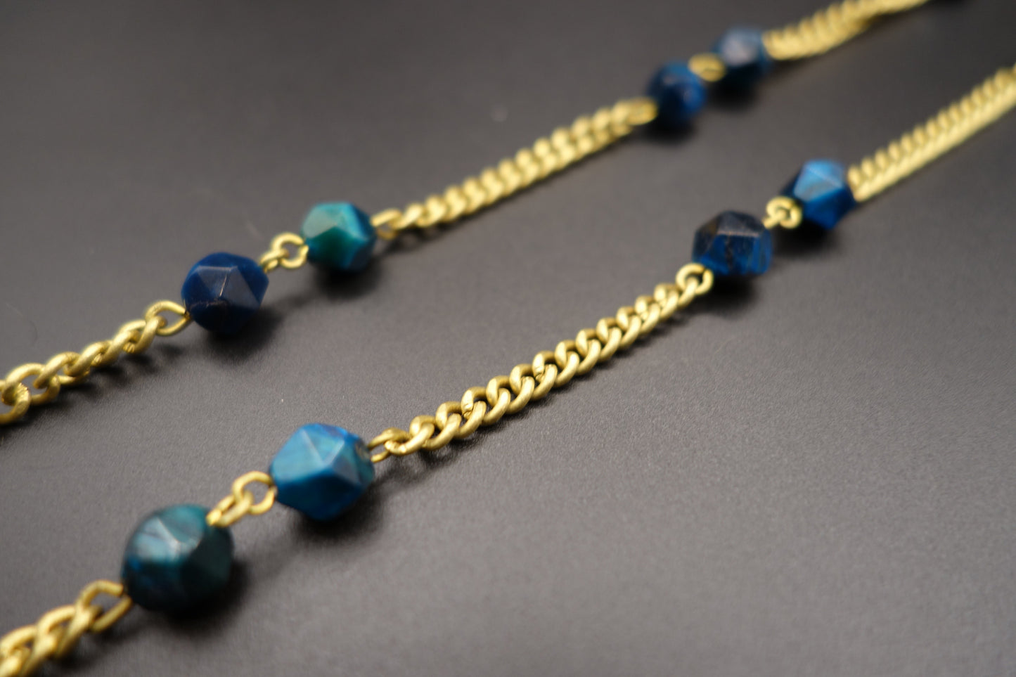 Blue Tiger’s Eye Brass Eyewear Chain – Bold Style with Meaningful Detail